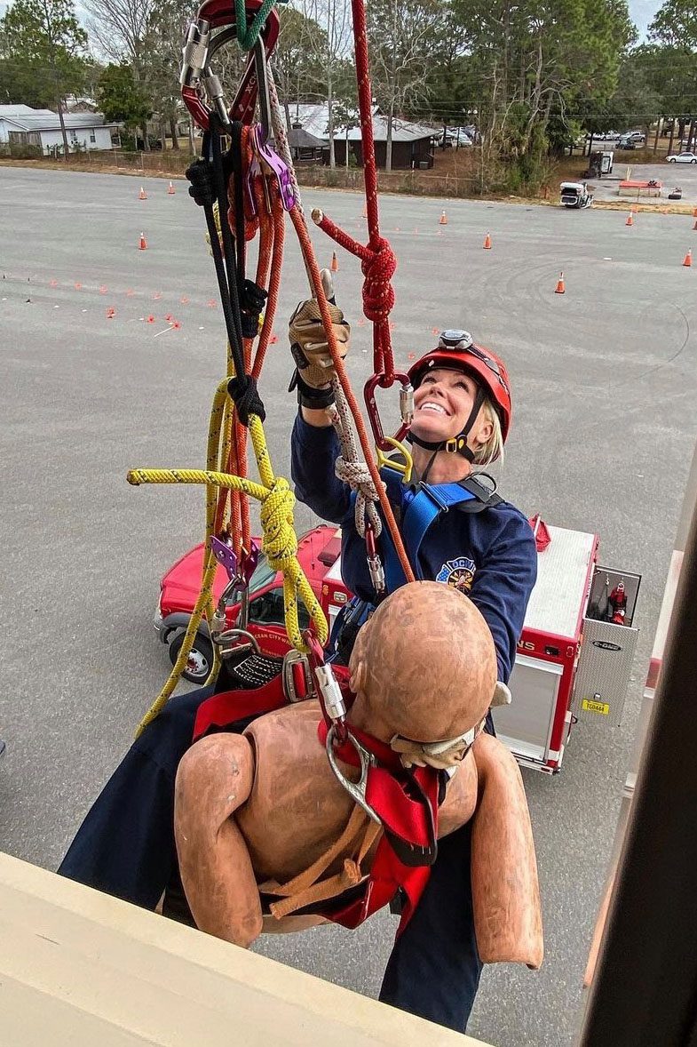 Donna Wood is seen rescuing a mannequin tied in intricate ropes.