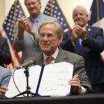 Texas Gov. Greg Abbott signs a bill