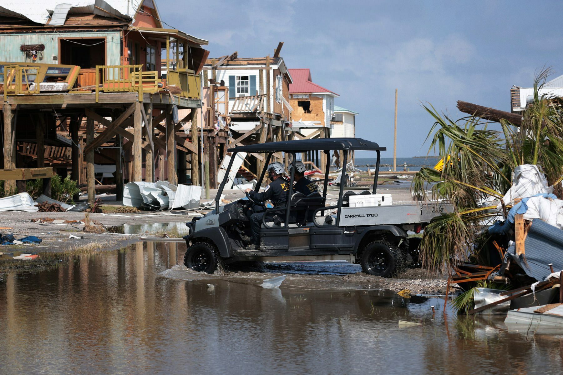 a search and rescue team in flooded Grand Isle, Louisiana