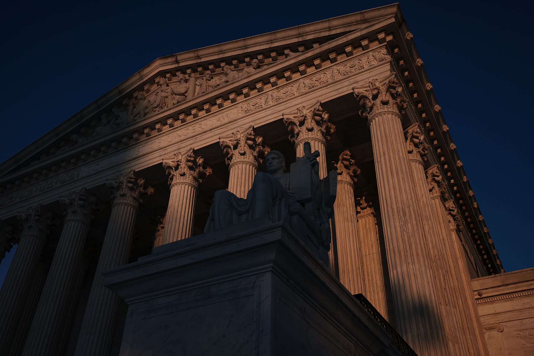 The U.S. Supreme Court is seen at sunset.