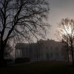 Fog surrounds the White House in the early hours of the morning.