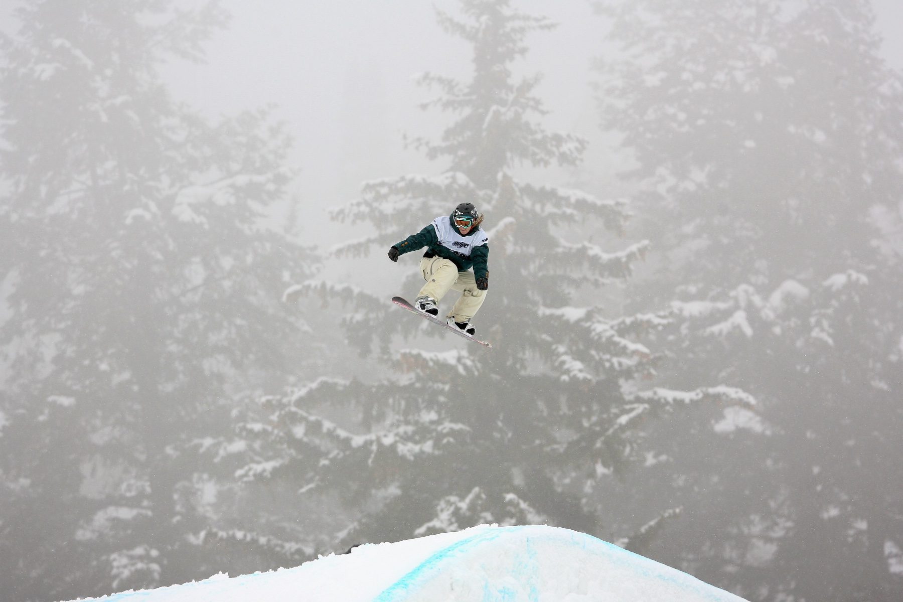Kimmy Fasani goes airborne on a snowboard.