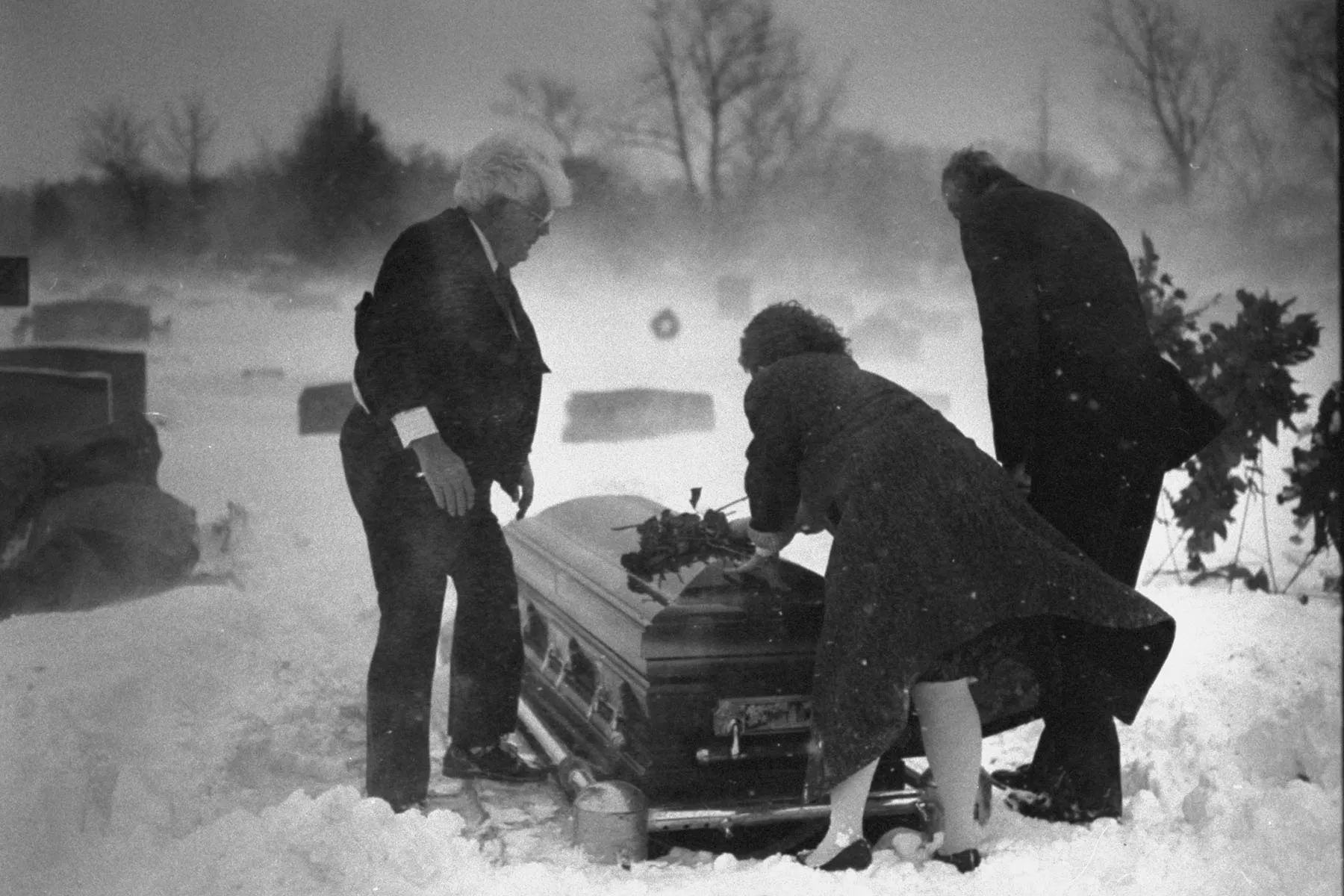 Peter and Maye Gun lay flowers on their son's casket.