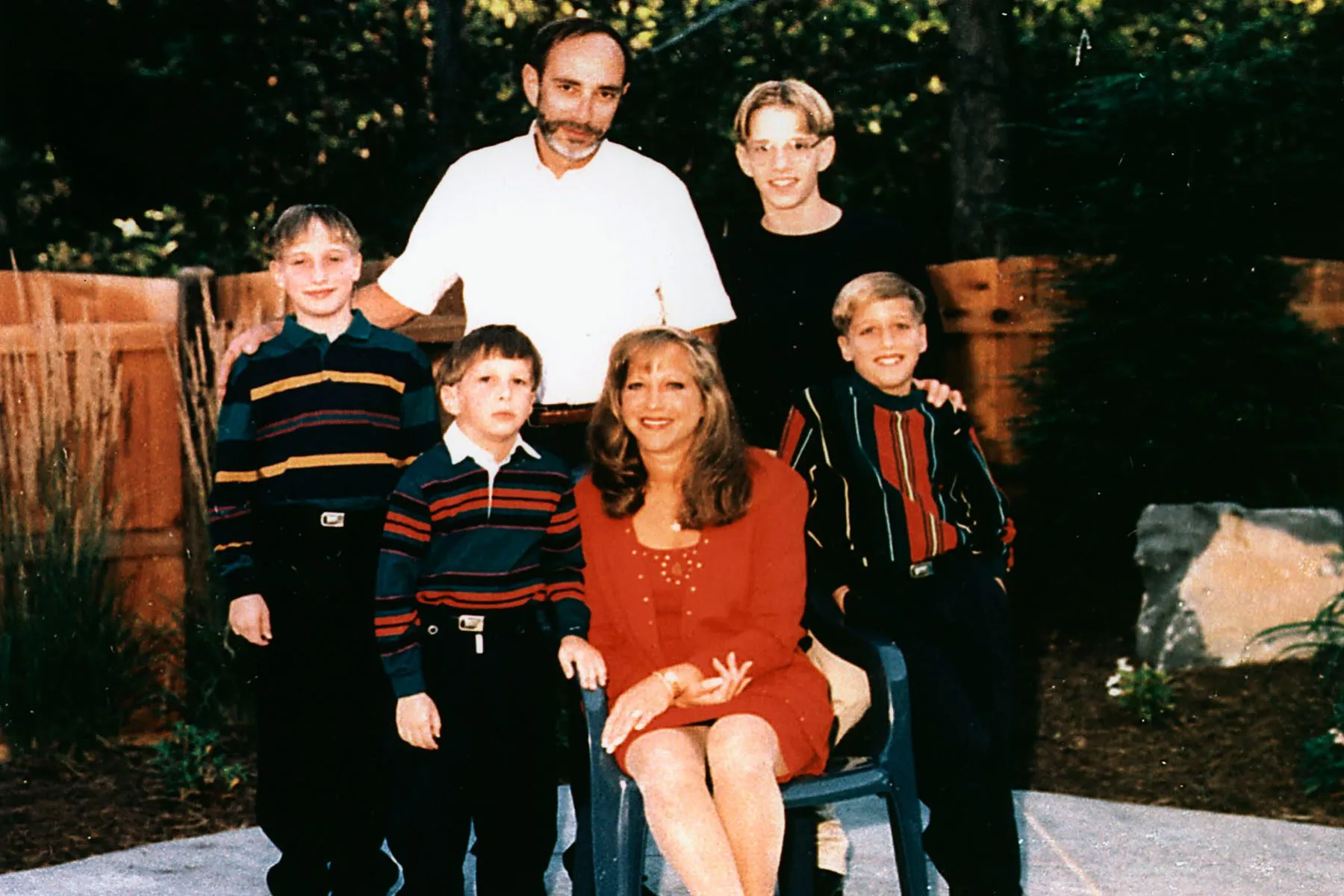 A family photo shows the Slepian family in their backyard.