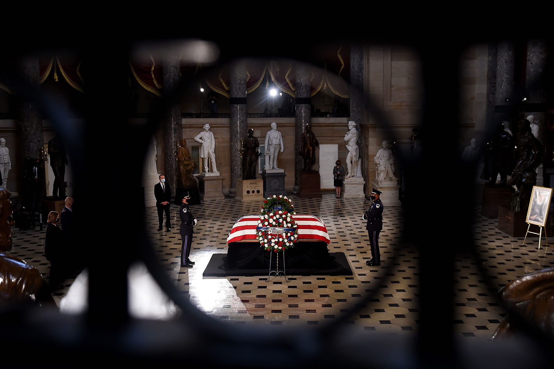 The flag-draped casket of the late Associate Justice Ruth Bader Ginsburg lies in state at the U.S. Capitol.