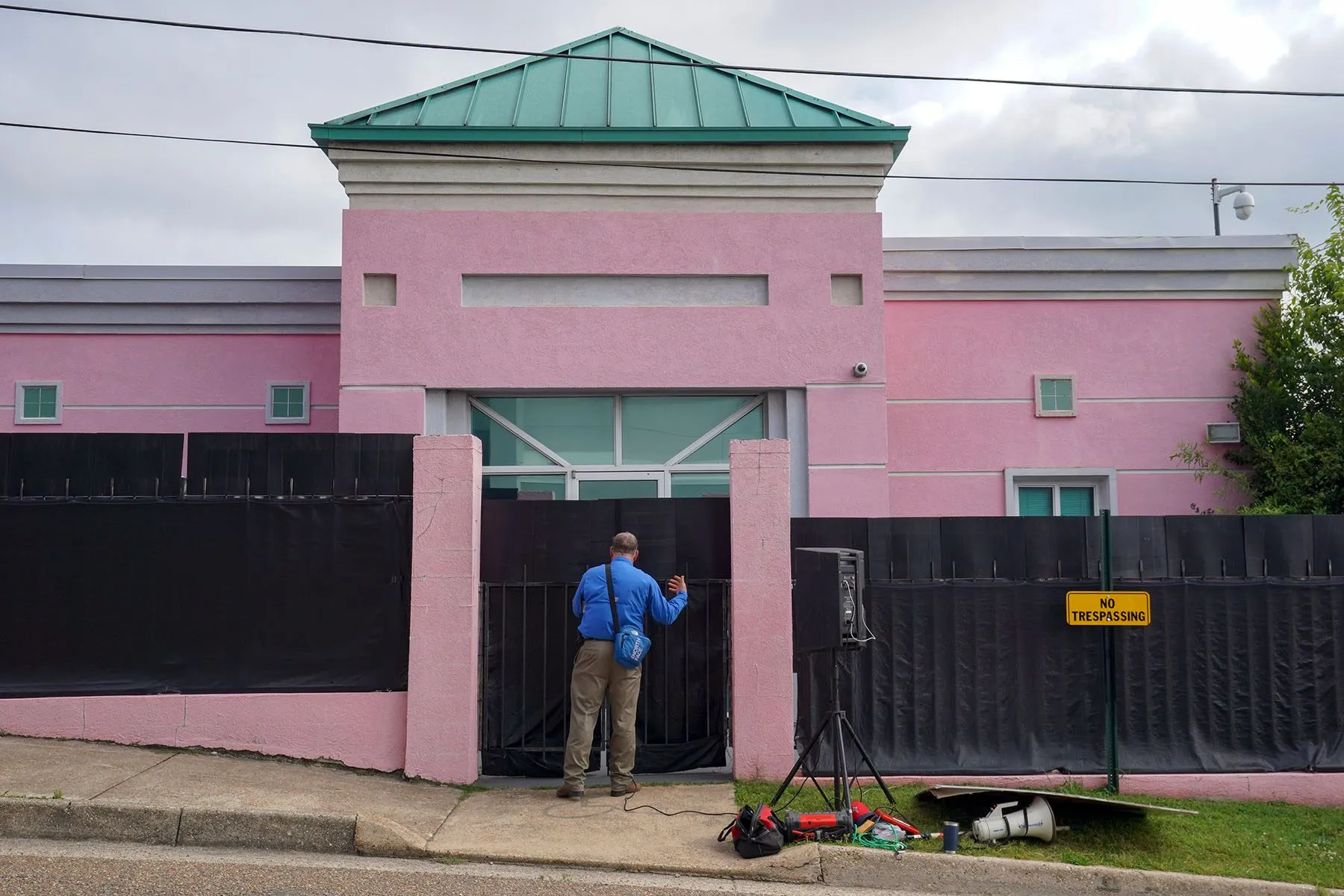 An anti-abortion activist prays aloud outside the Jackson Women's Health Organization