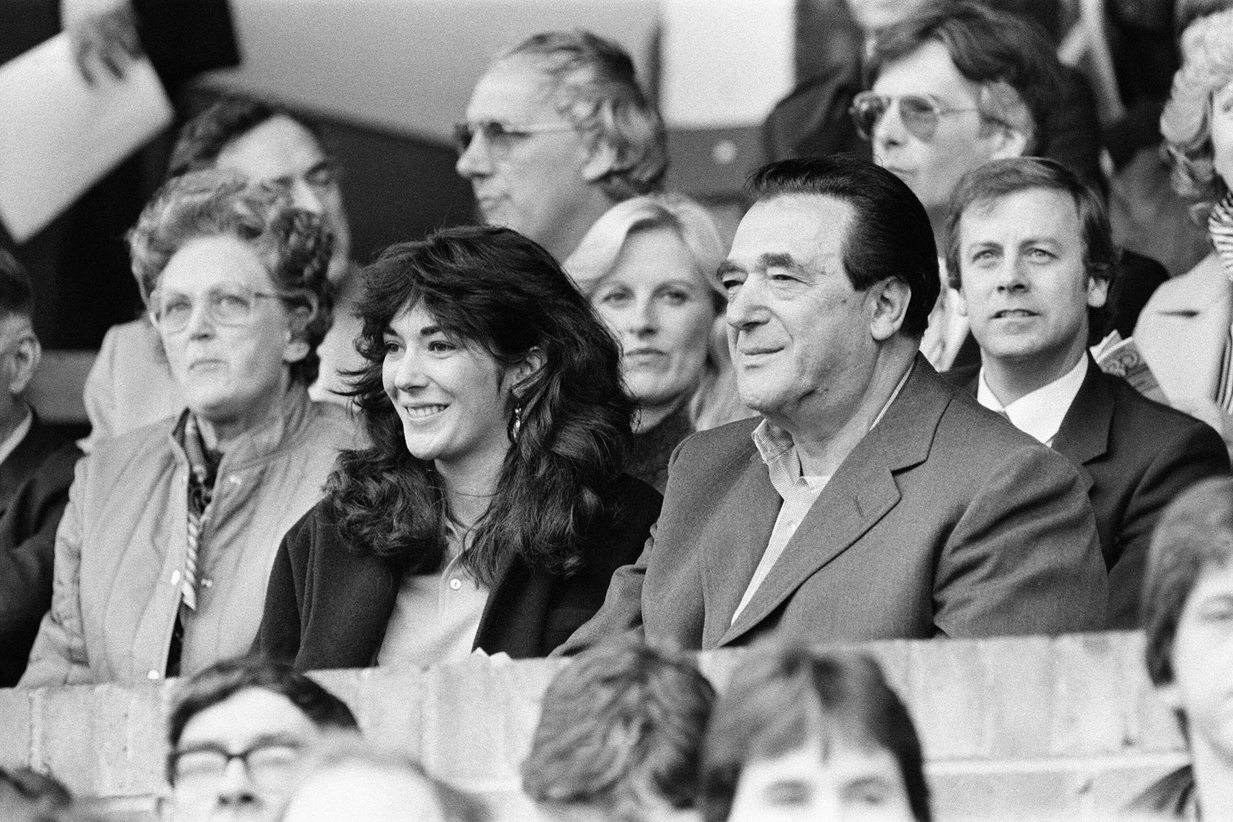 Ghislaine Maxwell and her father watch a soccer match together.