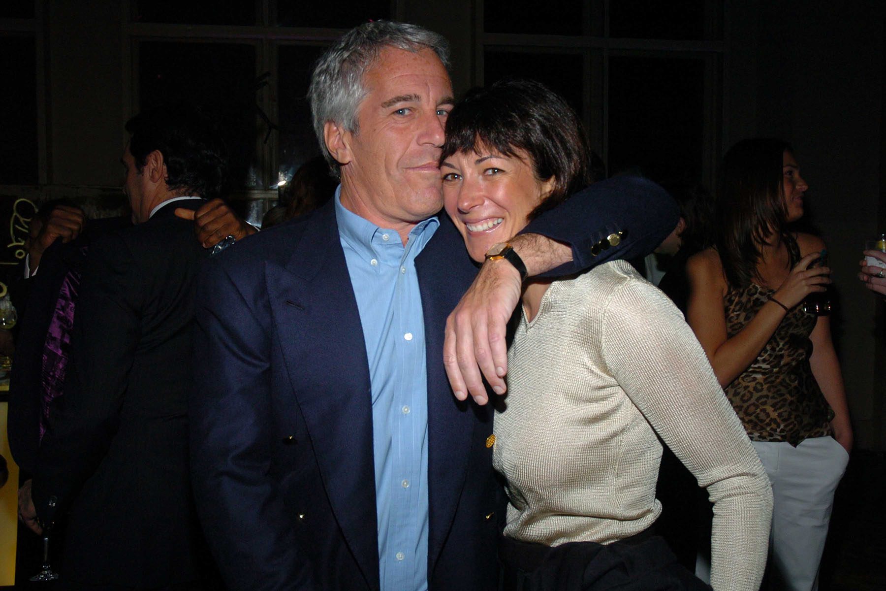 Jeffrey Epstein holds Ghislaine Maxwell at a New York City event.