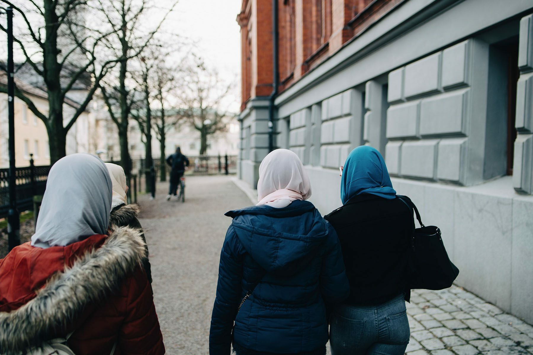 Rear view of girls wearing hijabs.