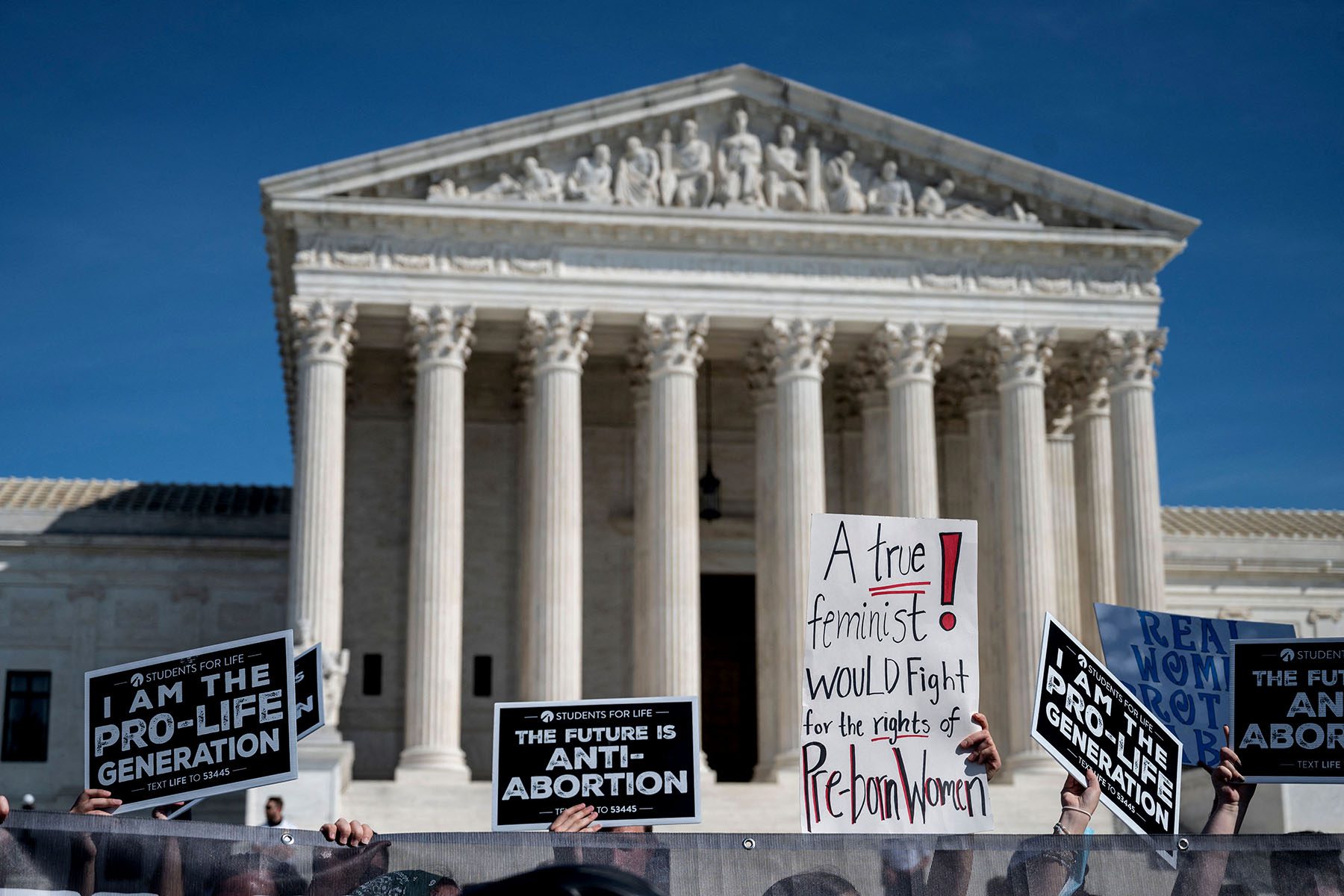 Anti-abortion activists counter-protest the Women's March at the U.S. Supreme court.