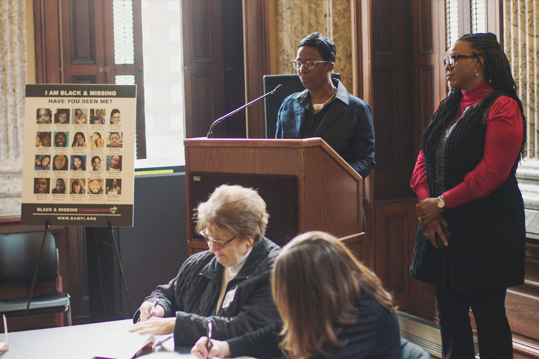 Natalie and Derrica Wilson speak during a presentation at Baltimore City Hall.