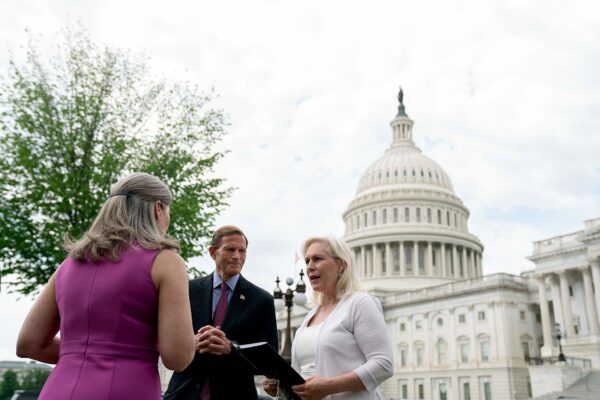 Sen. Gillibrand speaks to Sen. Blumenthal and Sen. Ernst outside the U.S. Capitol