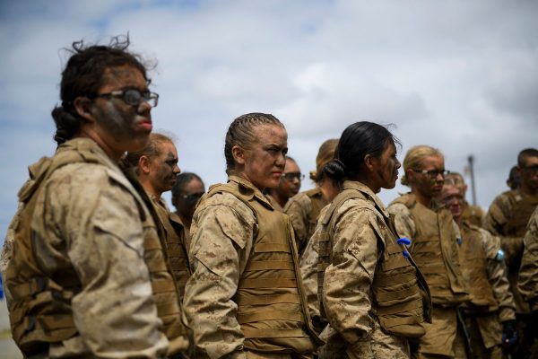 Women Marine Corps recruits listen during a safety briefing.