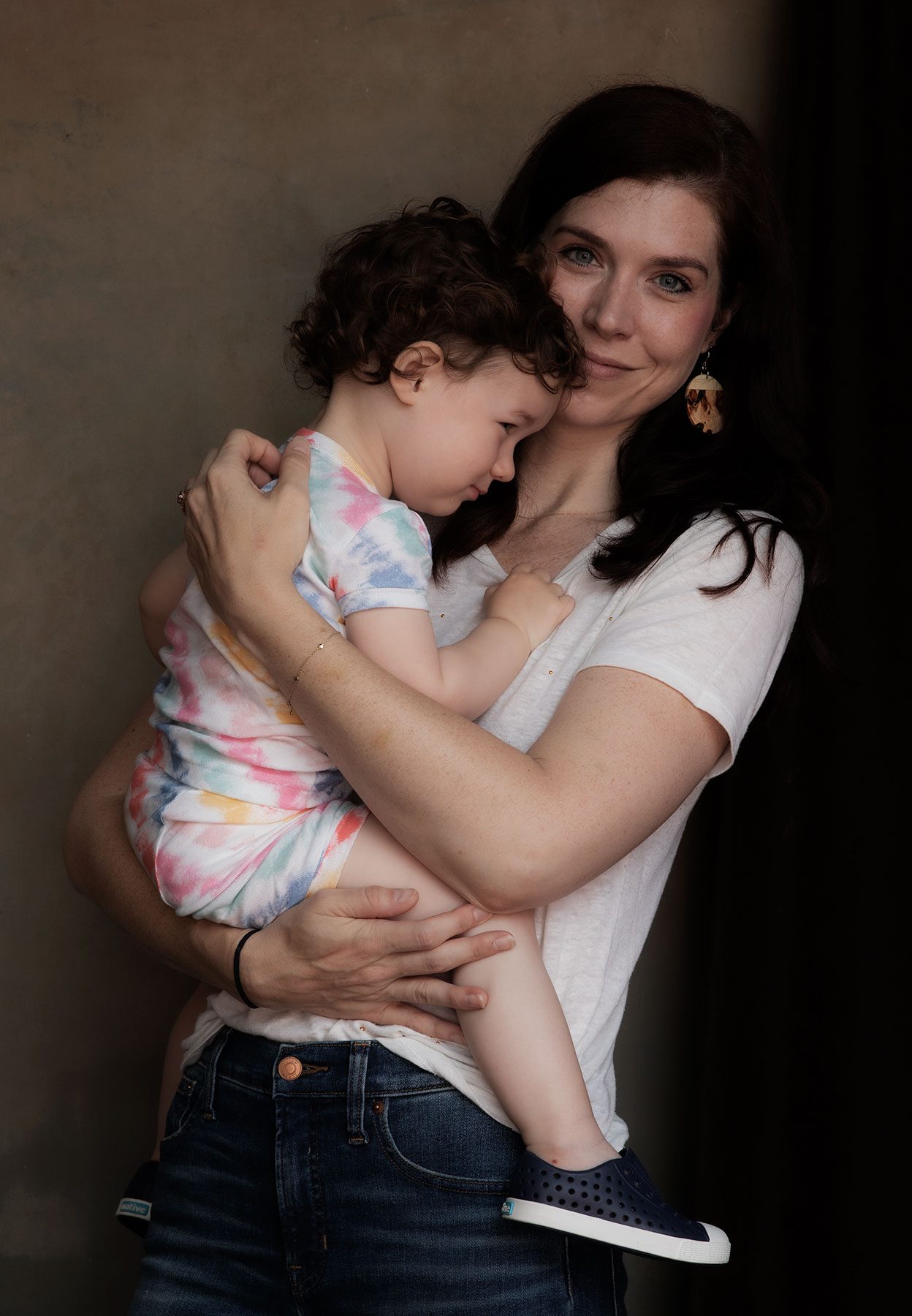 Christina Wallace holds her daughter as she poses for a portait.