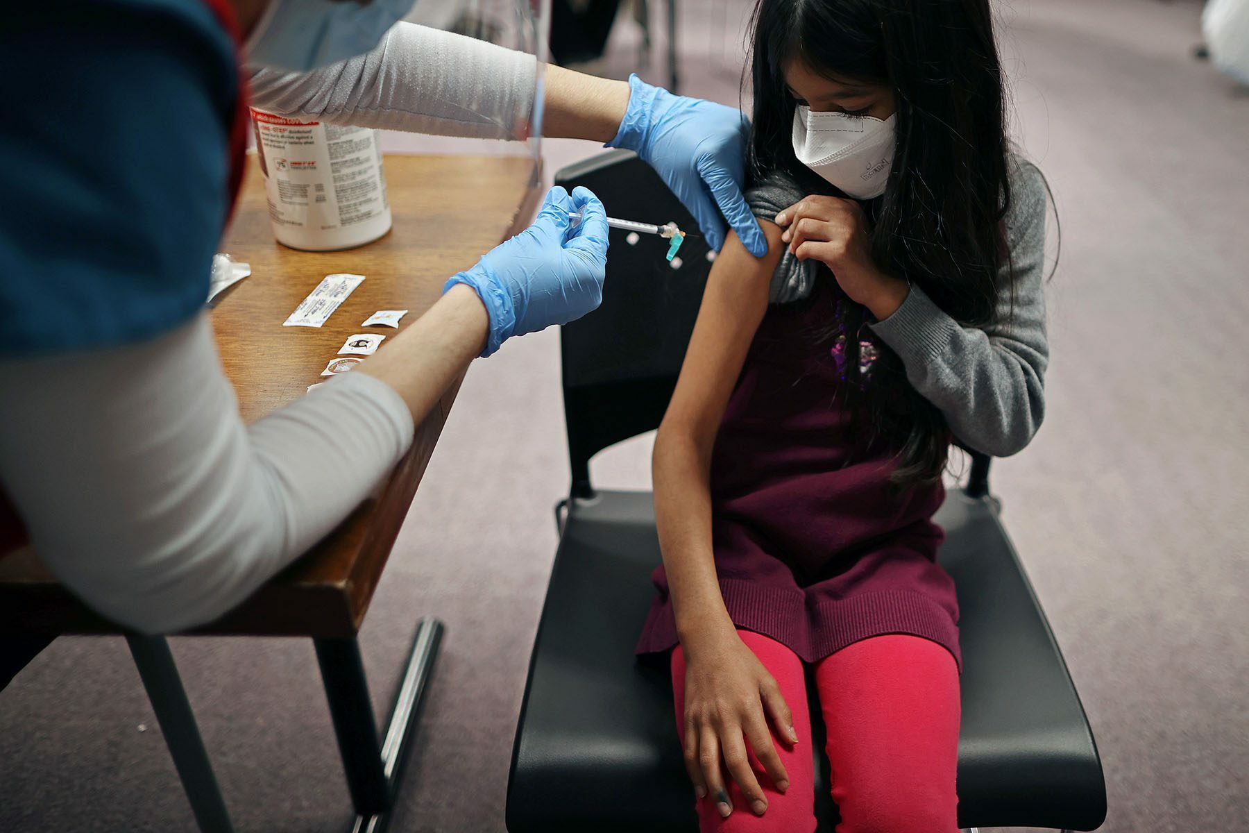 A child receives their COVID-19 vaccination.