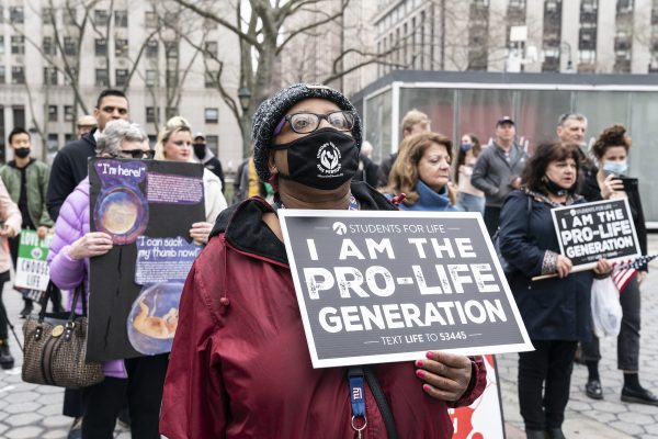 Woman with placard at anti-abortion protest in Foley Square, New York City
