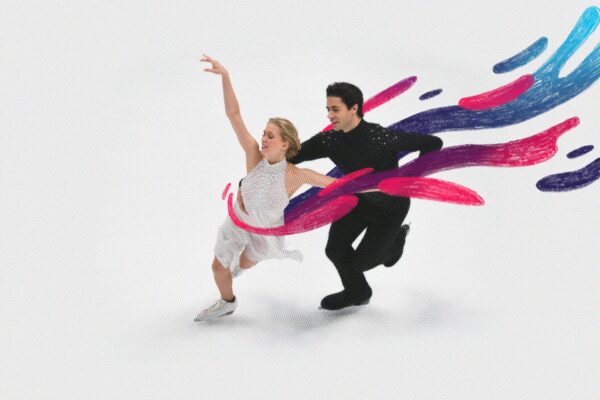 Kaitlyn Weaver and Andrew Poje skate in a competition.