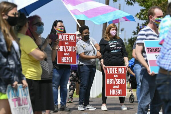 Opponents of several bills targeting transgender youth attend a rally at the Alabama State House.