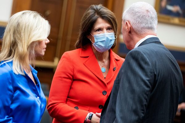 Gretchen Carlson, Cheri Bustos and Ken Buck speak amongst each other on Capitol Hill.