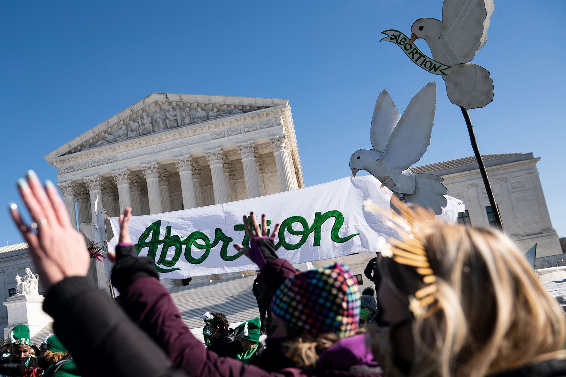 Abortion rights activists demonstrate in front of Supreme Court.