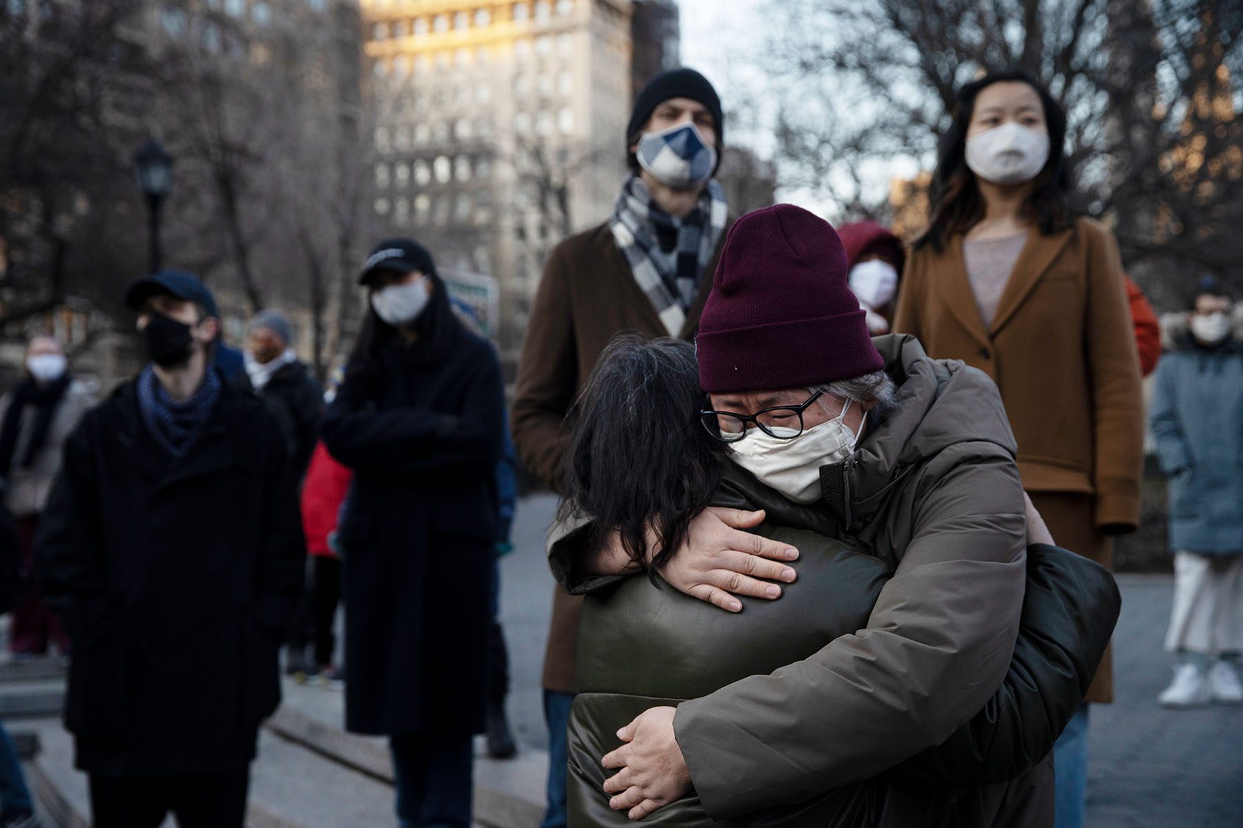 New Yorkers hug while rallying in Union Square.