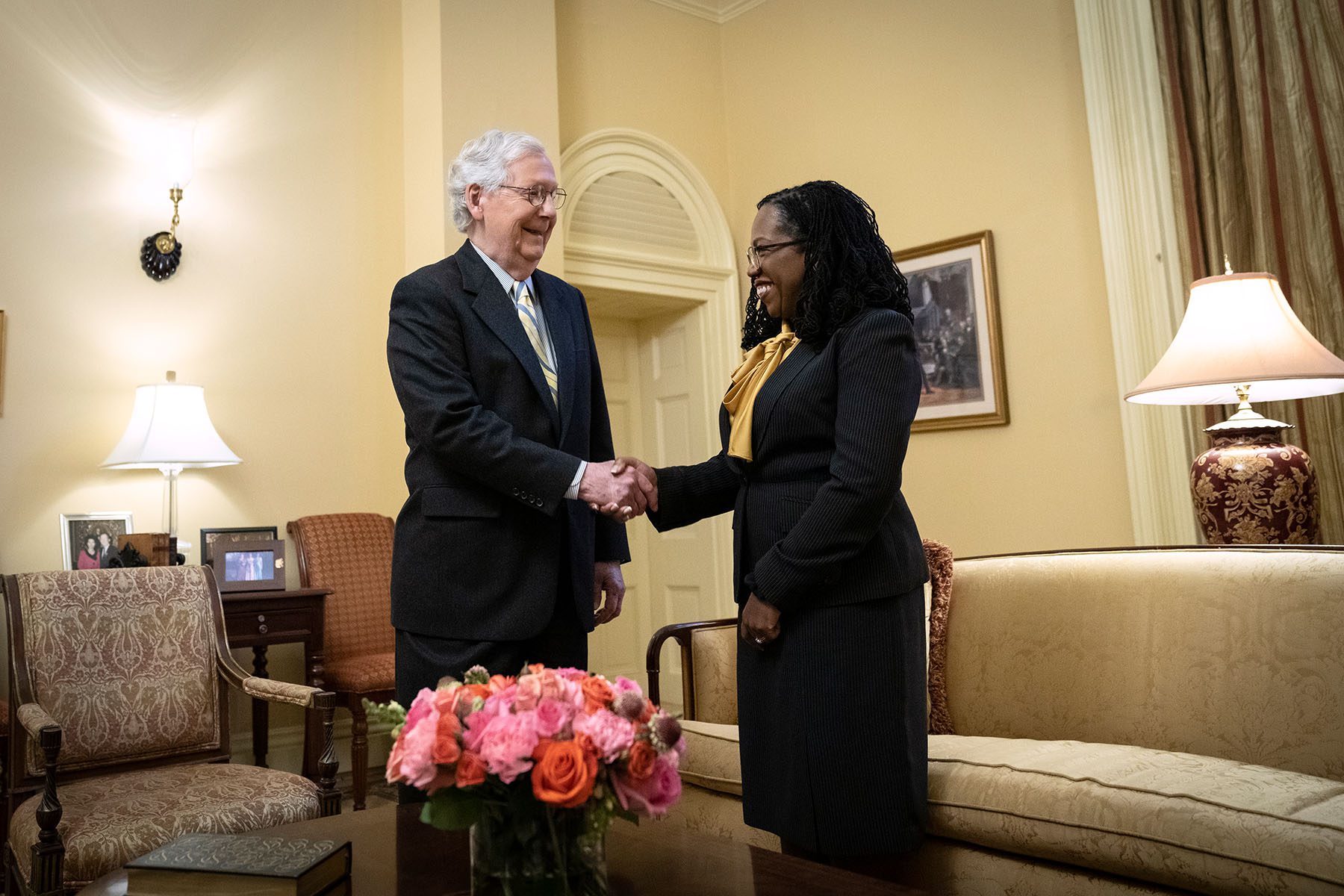 Senate Minority Leader Mitch McConnell shakes hands with Supreme Court Nominee Judge Ketanji Brown Jackson at the start of their meeting in his Capitol Hill office.