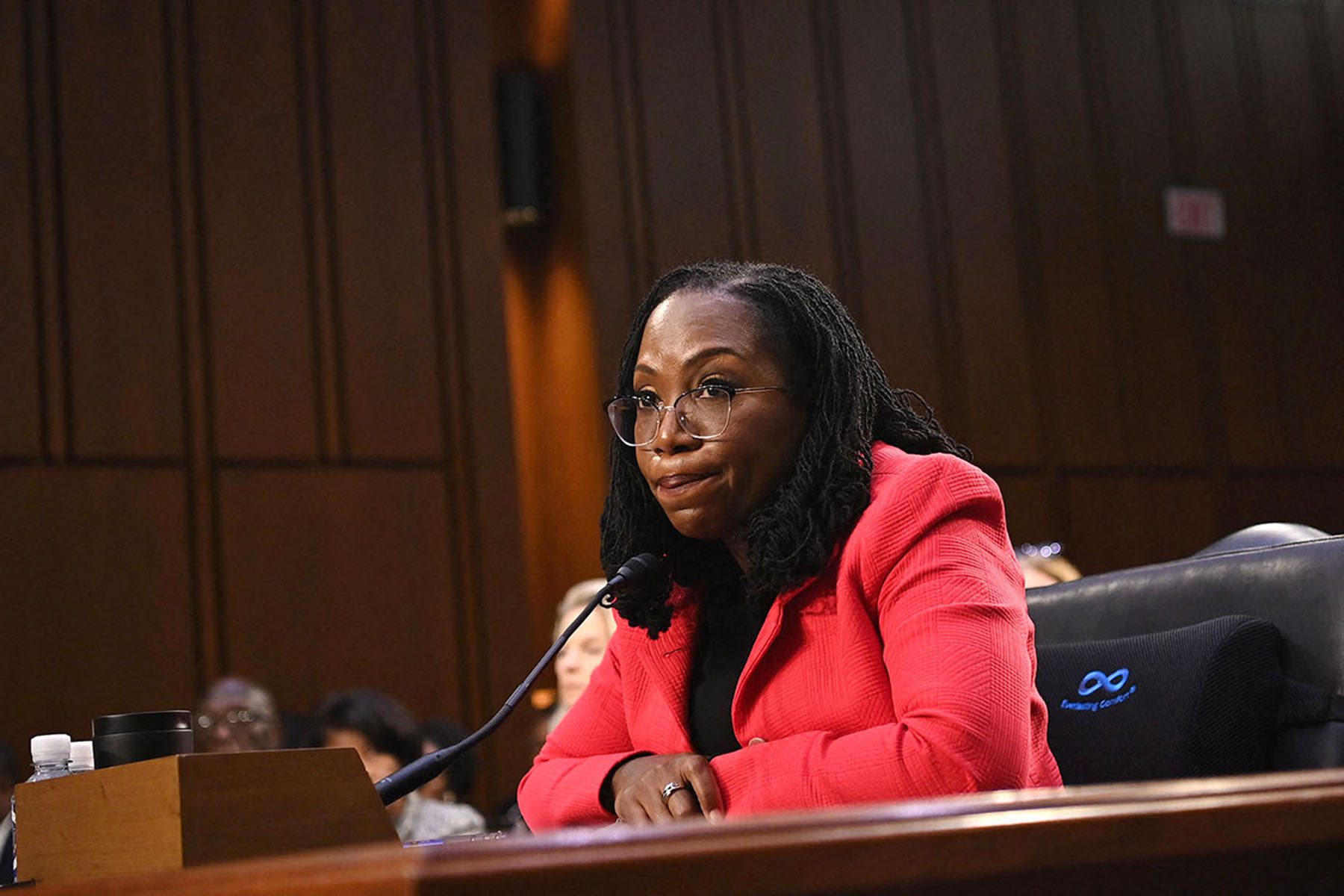 Judge Ketanji Brown Jackson looks at Sen. Ted Cruz with raised eyebrows are he speaks during her confirmation hearing.