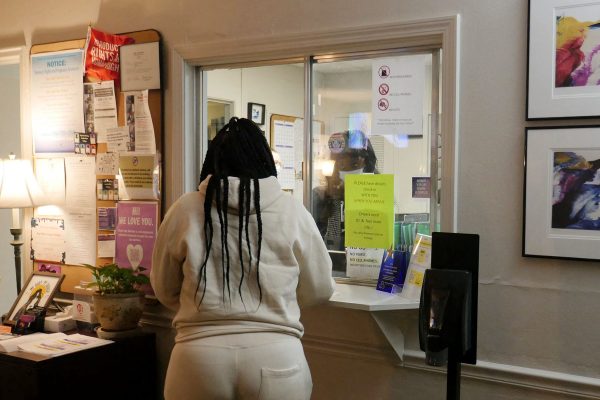 A woman stands at the check-in window of an abortion clinic in Louisiana.