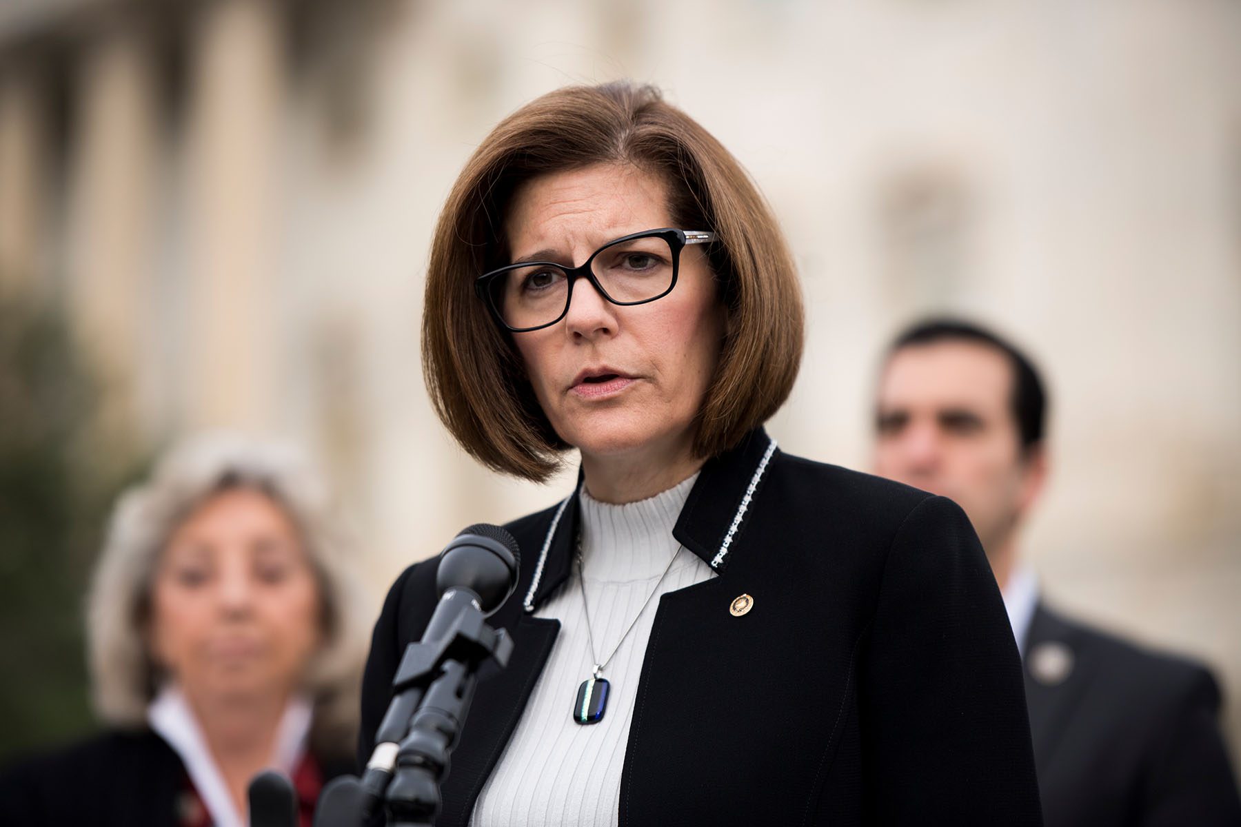 Catherine Cortez Masto speaks into a microphone.