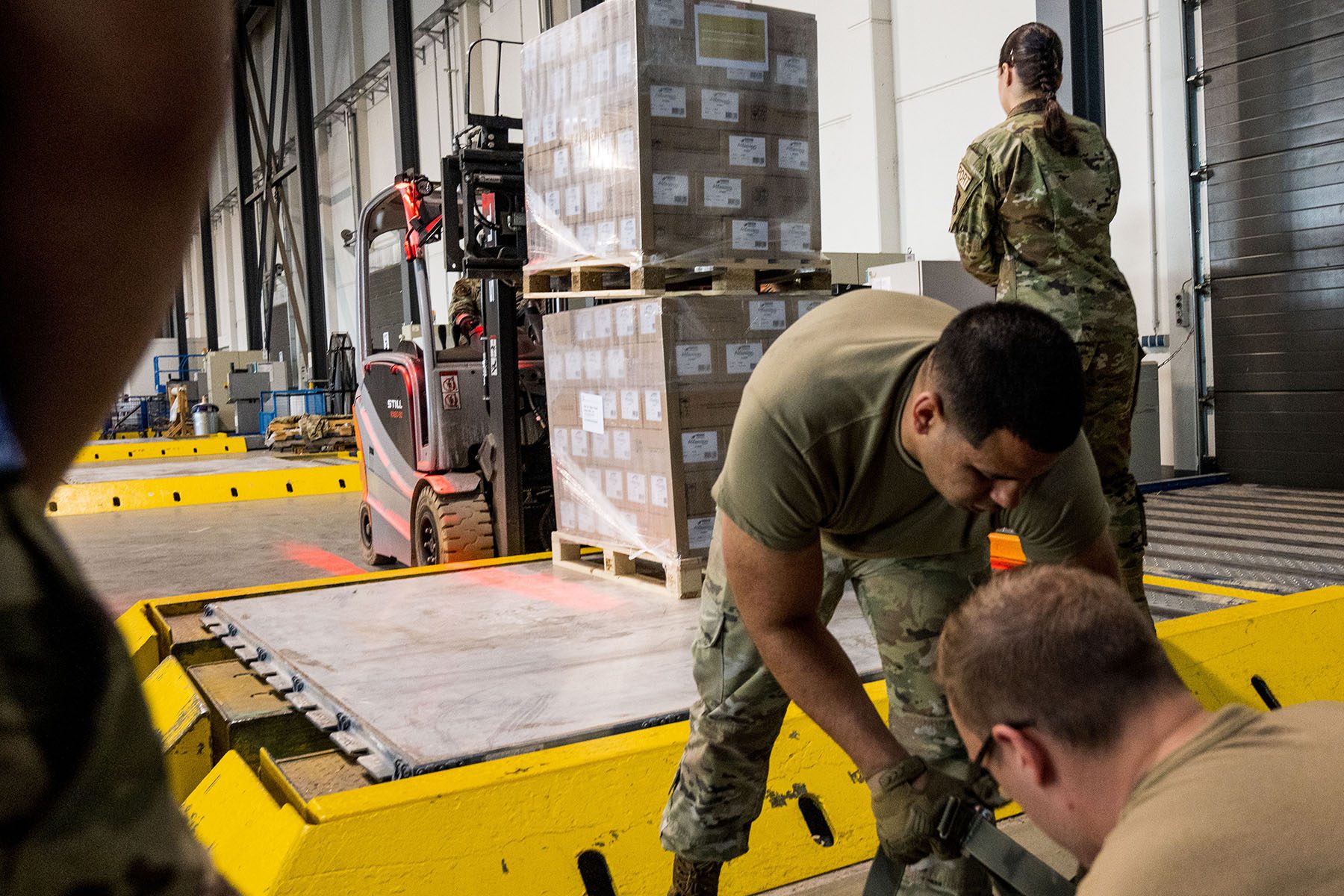U.S. airmen load pallets of baby formula at the Ramstein American Air Force base.