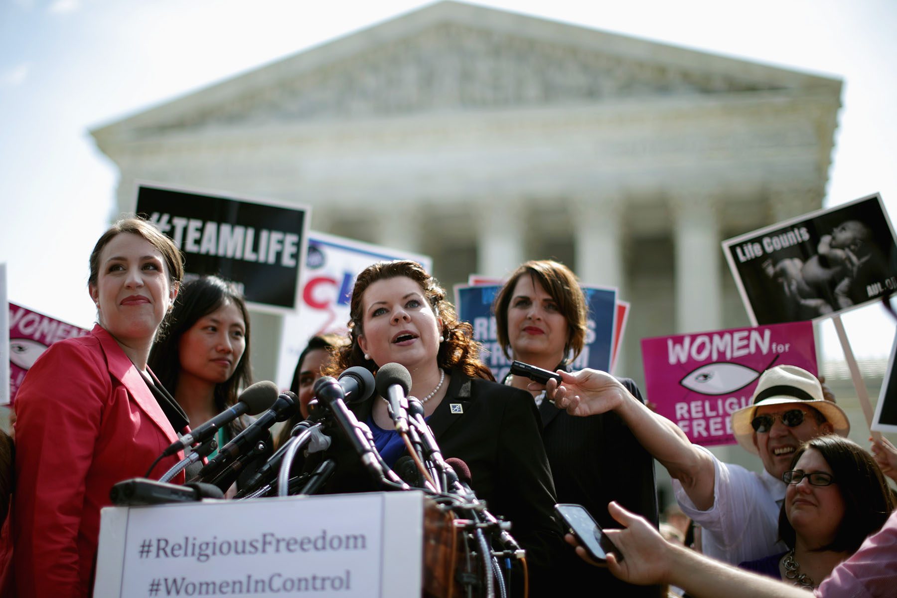 Lori Windham addresses the media in front of the U.S. Supreme Court building.