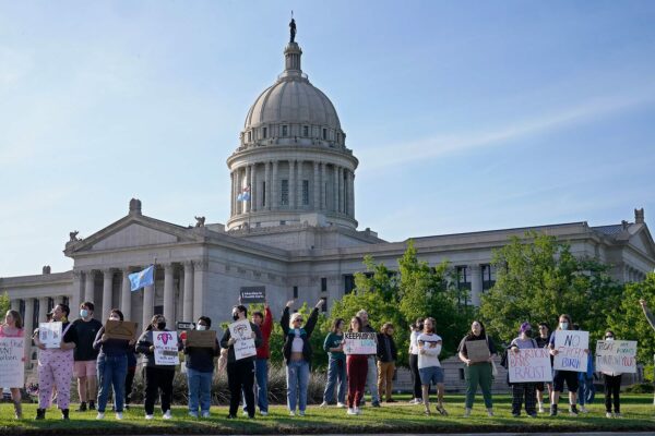 Abortion-rights supporters rally in front of the State Capitol. Signs read 