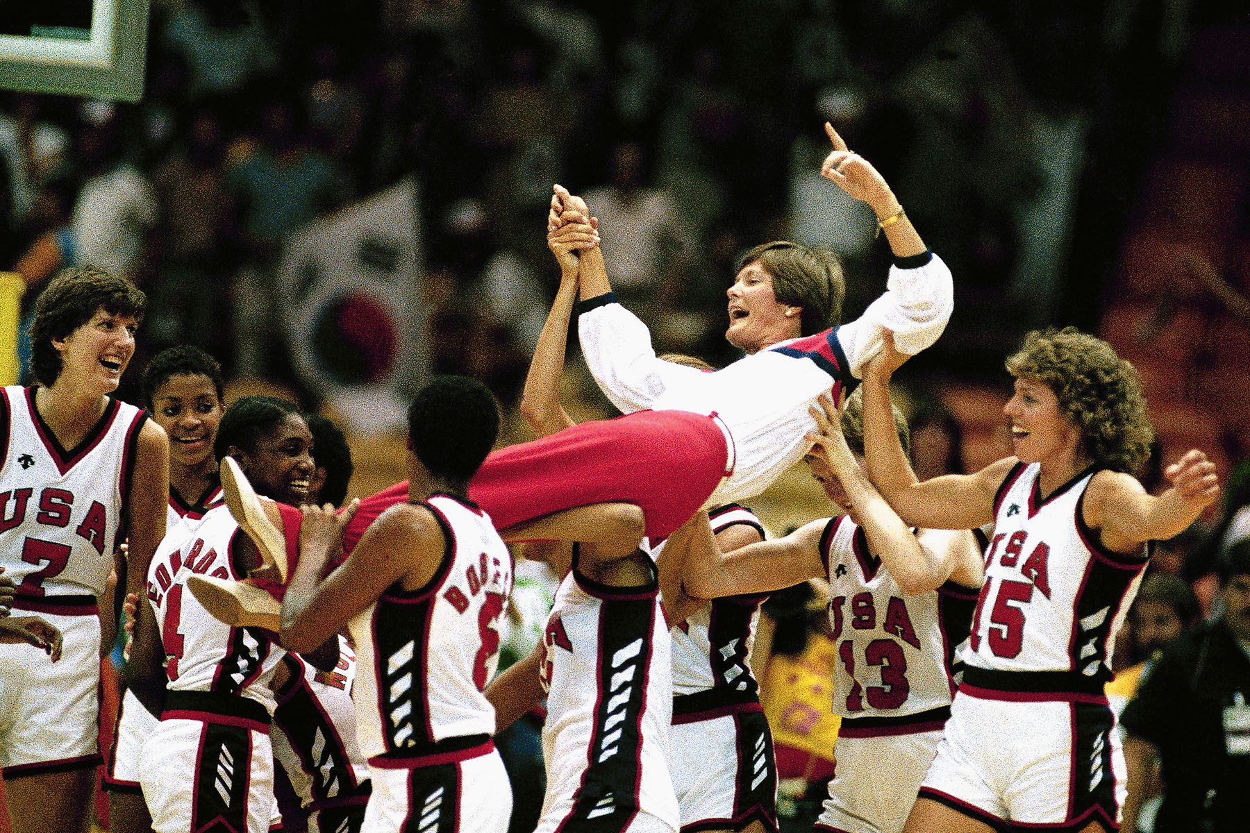 U.S. women's basketball coach Pat Summitt is carried off by members.
