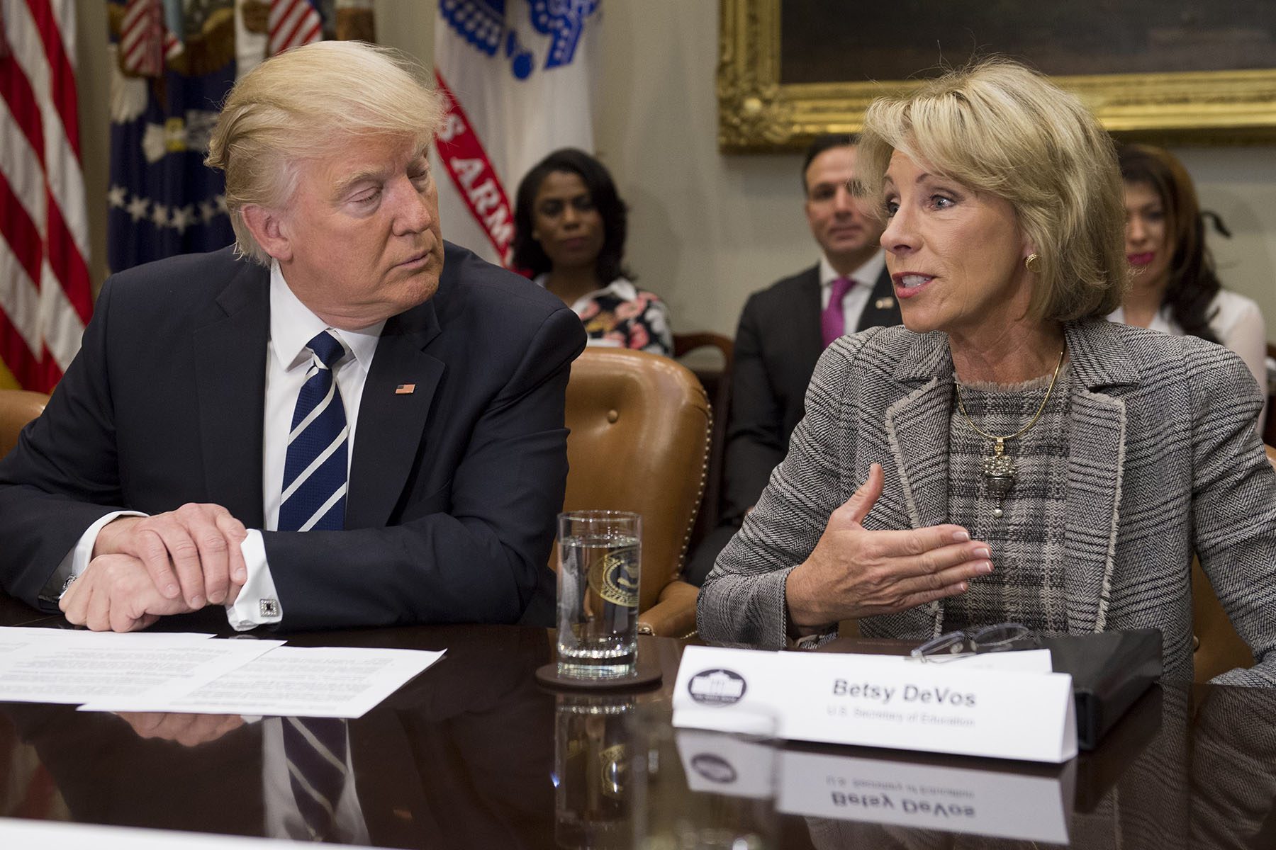 President Trump and Secretary of Education Betsy DeVos attend a meeting with teachers, school administrators and parents.
