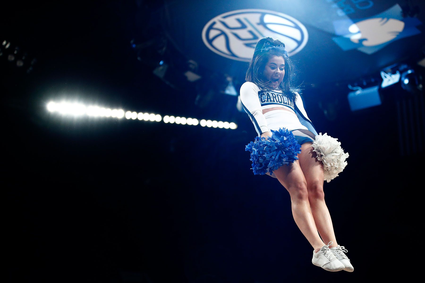 Three Female Cheerleaders Holding Pompoms High-Res Stock Photo - Getty  Images