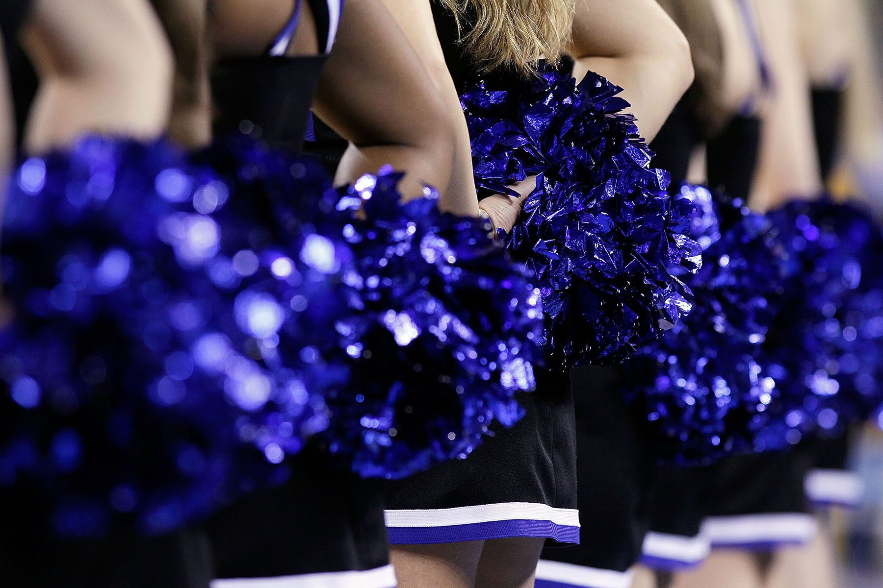 Professional Cheerleading: The Reality Behind The Pom-Poms