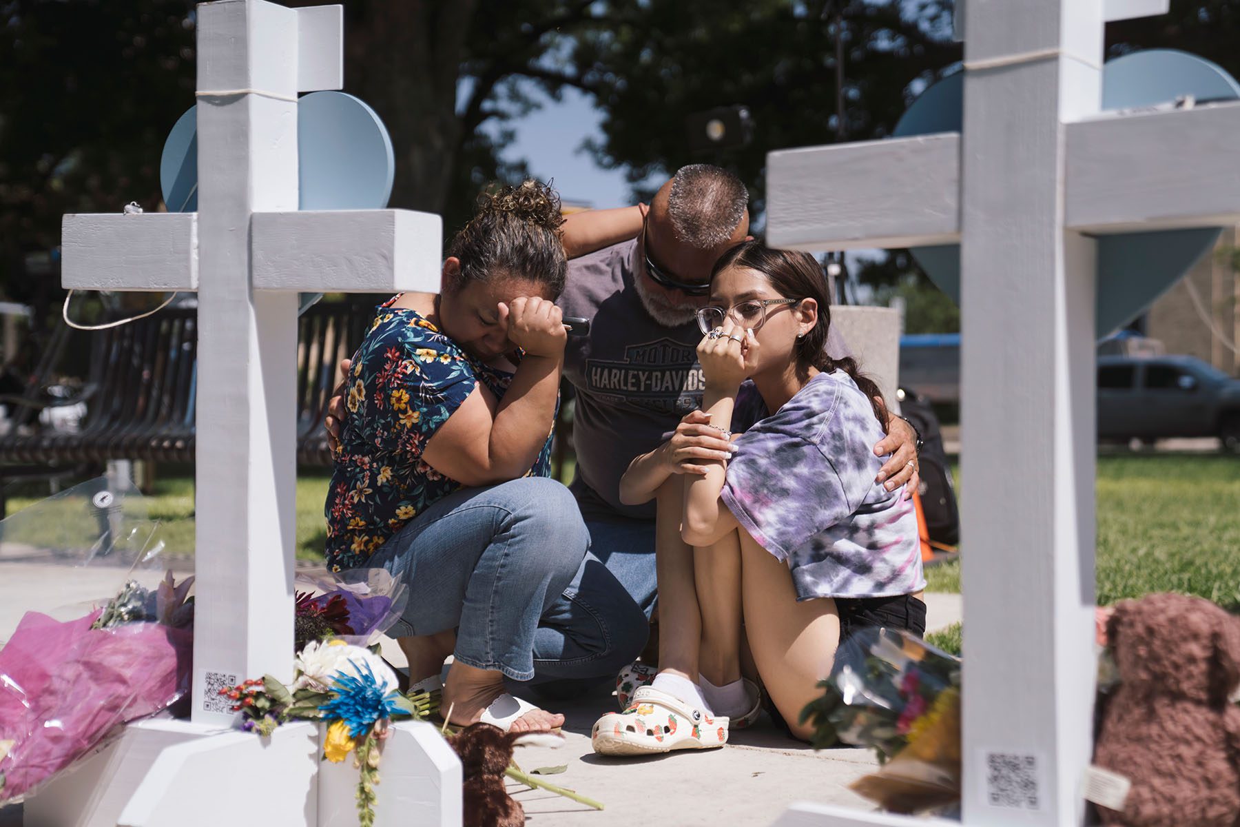 People visit a memorial in the town square for victims of the mass shooting in Uvalde, Texas.