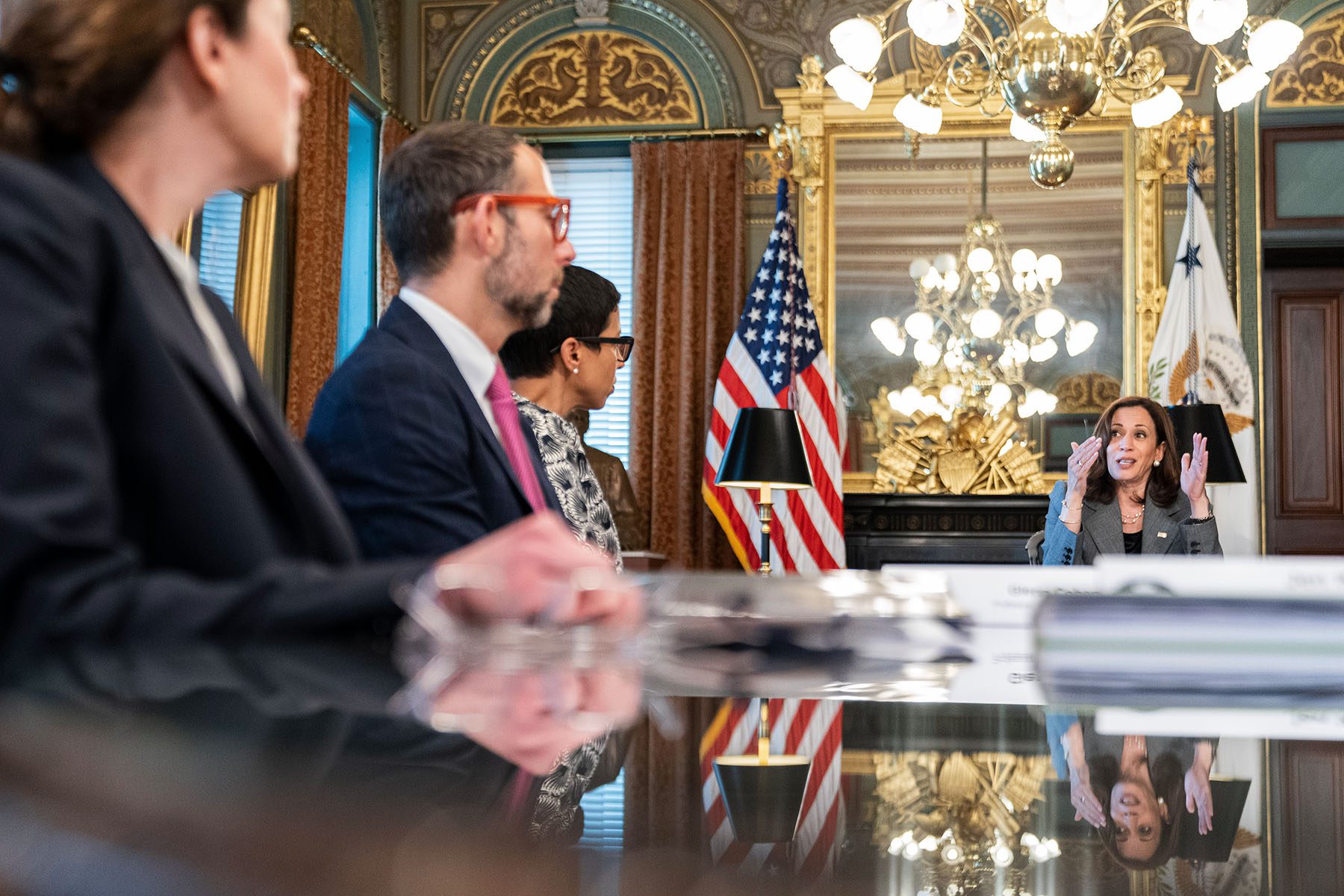 Vice President Harris speaks at a meeting in an ornate room of the White House complex.