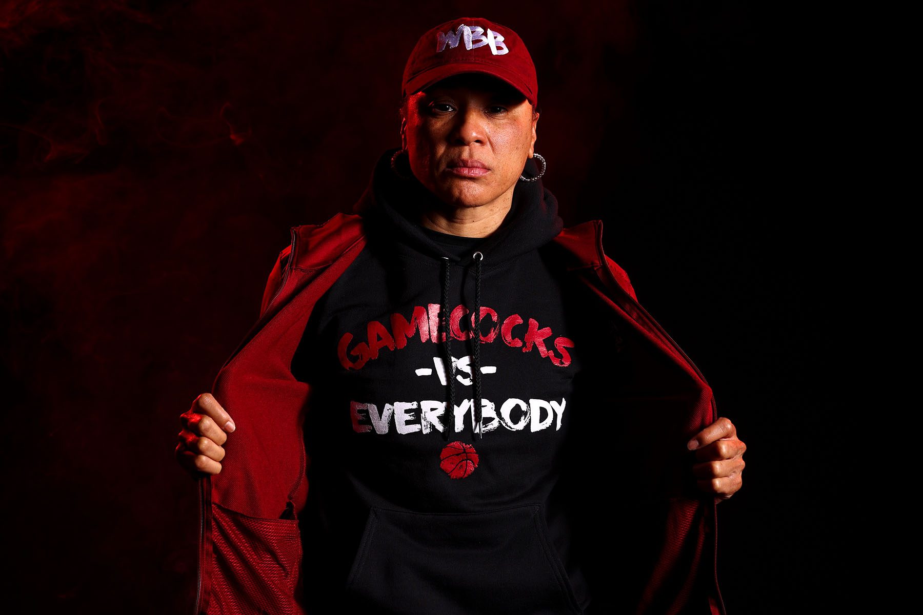 Dawn Staley shows off her hoodie which reads "Gamecocks vs. Everybody"