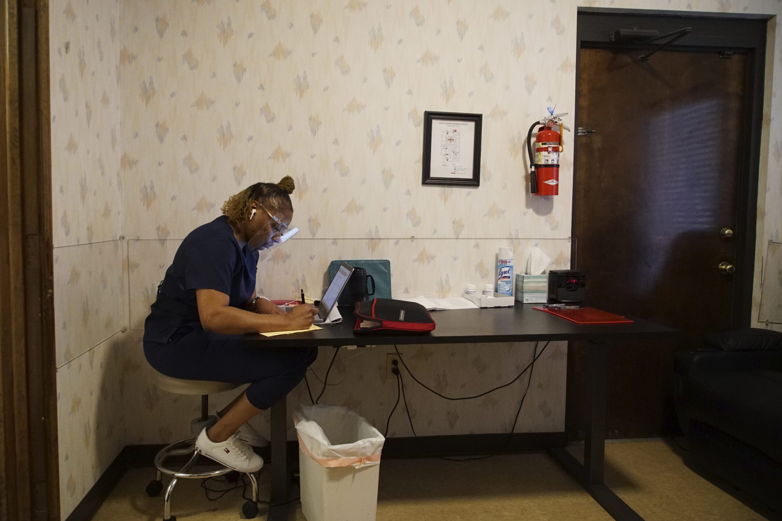 A woman works in the recovery room at the West Alabama Women's Center in Tuscaloosa, Alabama.