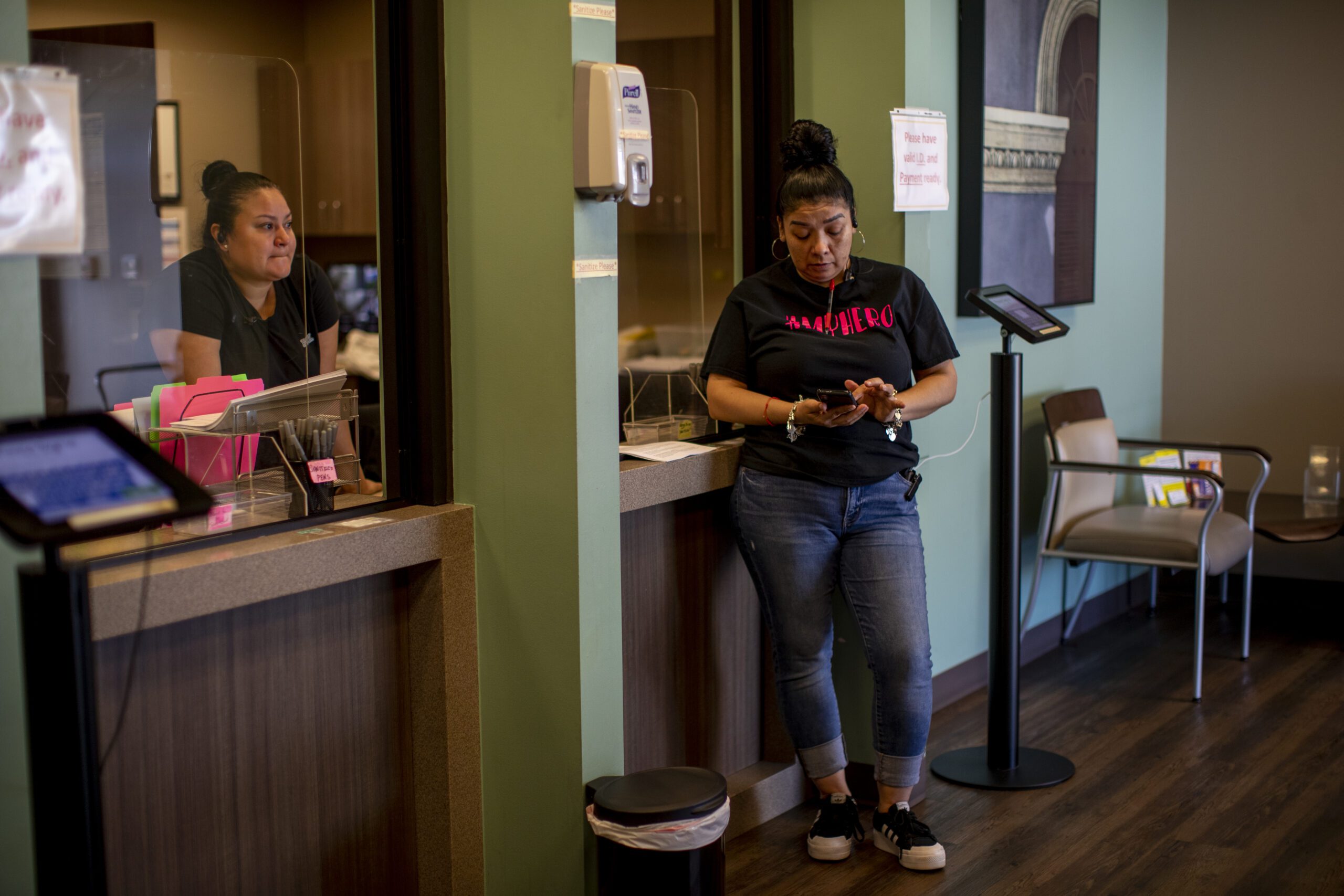 Staff members stand in an abortion clinic waiting room.