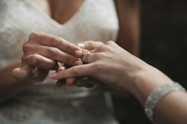 Cropped shot of two unrecognisable women exchanging rings on their wedding day