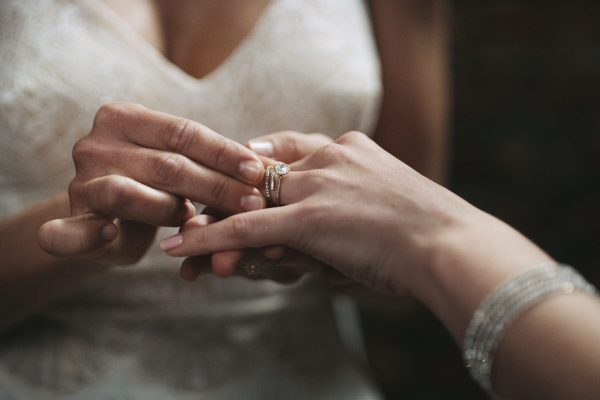 Cropped shot of two unrecognisable women exchanging rings on their wedding day