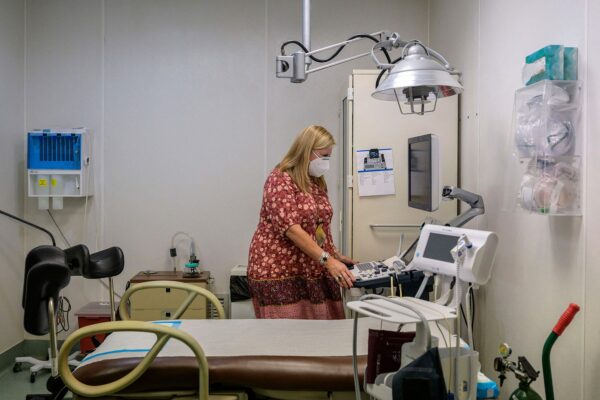 Julie Burkhart, co-owner of the Hope Clinic For Women, looks at an ultrasound machine inside an exam room.