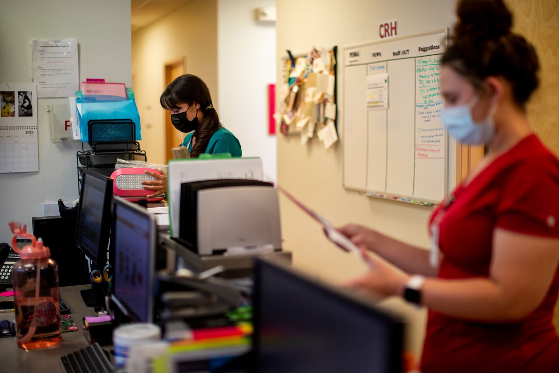 Medical staff check charts in a hallway at a New Mexico abortion clinic.