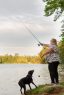 JulieAnn Fitzy fishes with her dog.