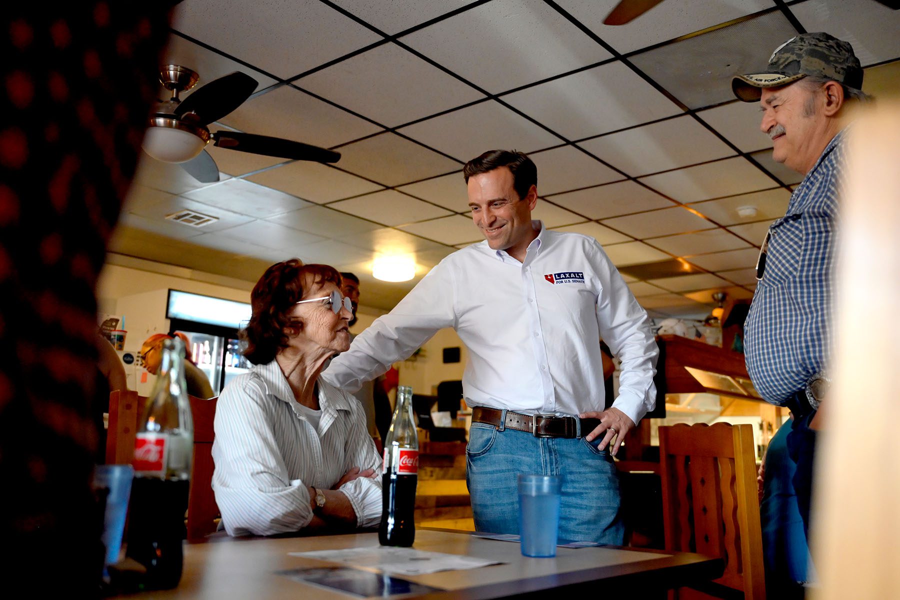 Adam Laxalt greets people during a campaign event at a restaurant.