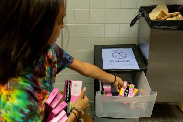 student stocks bathroom with free tampons and pads to combat period poverty