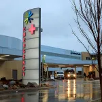 Emergency entrance at urban hospital at dusk with lighted sign, Kootenai Health hospital in Coeur d'Alene Idaho