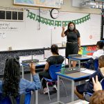 A teacher teaches a third grade class.